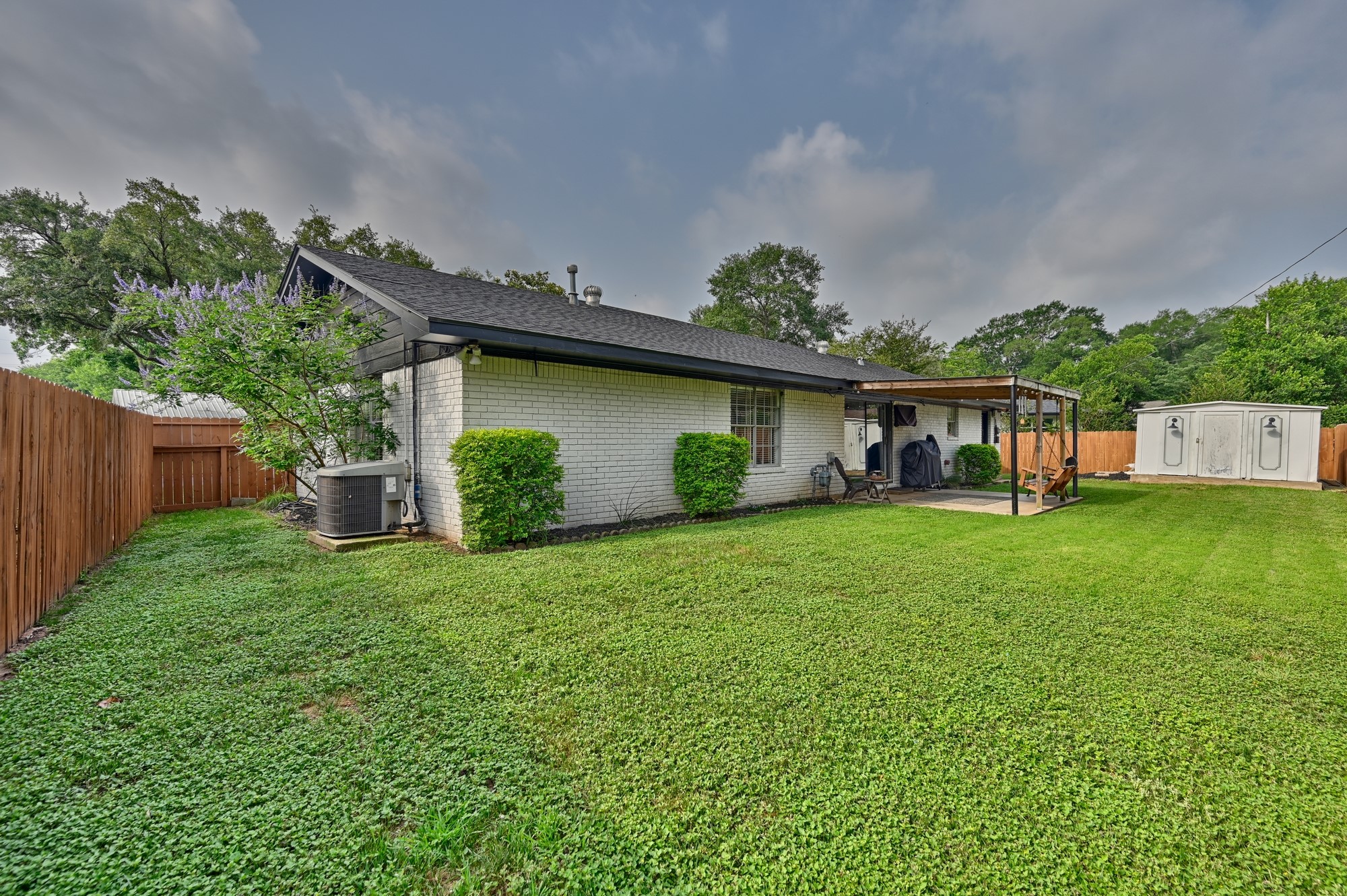 507 Sandra Drive Brenham, TX 77833 - Photo 16 of 30 a front view of a house with garden