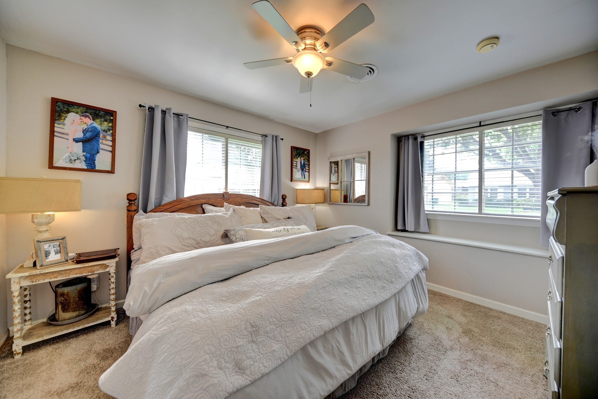 507 Sandra Drive Brenham, TX 77833 - Photo 18 of 30 a bedroom with a bed and a chandelier