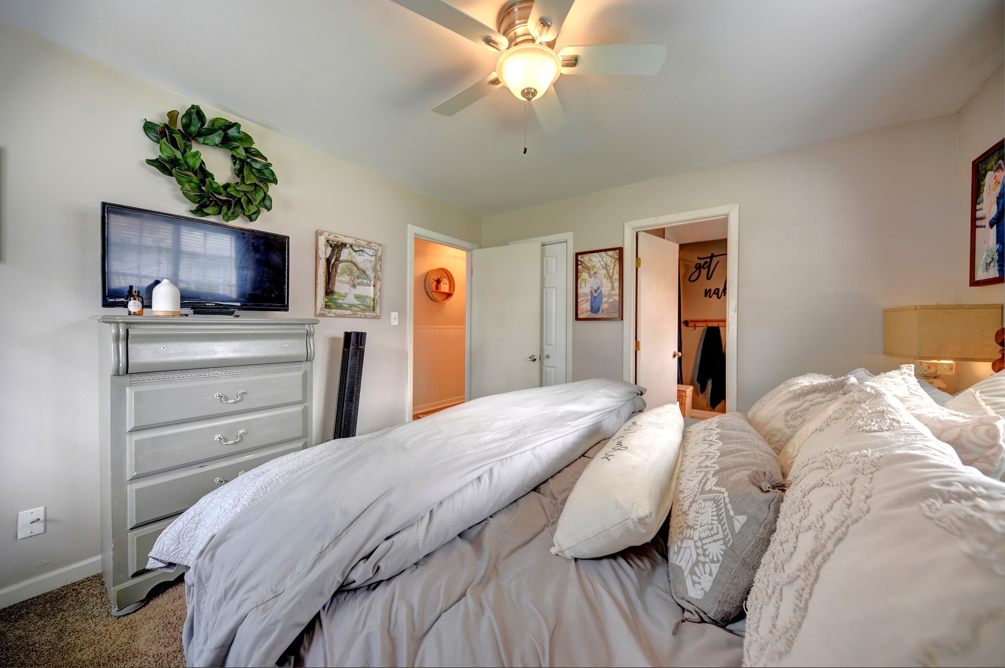 507 Sandra Drive Brenham, TX 77833 - Photo 19 of 30 a bedroom with a bed and a flat screen tv