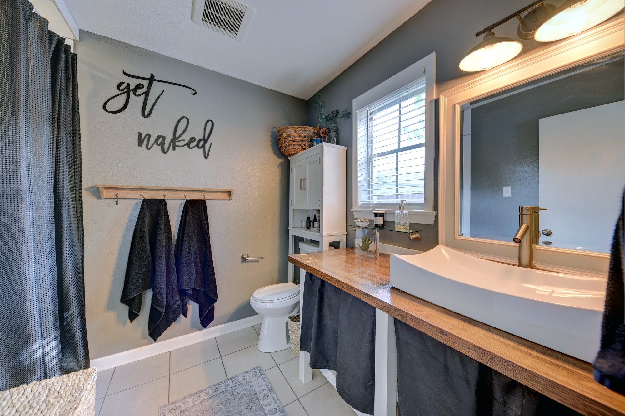 507 Sandra Drive Brenham, TX 77833 - Photo 20 of 30 a view of walk in closet with clothes and shoes