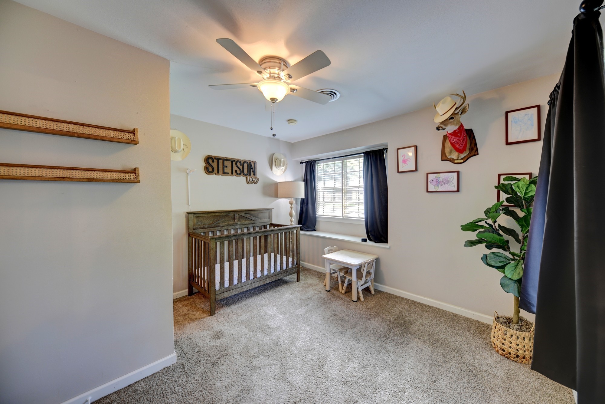 507 Sandra Drive Brenham, TX 77833 - Photo 22 of 30 a living room with furniture and a chandelier