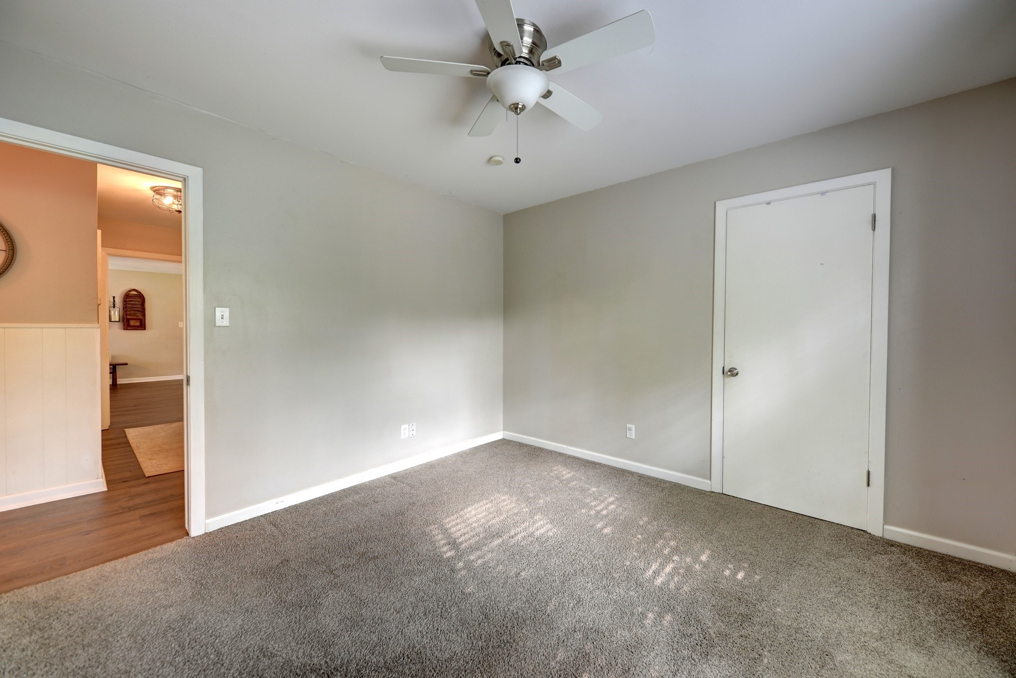 507 Sandra Drive Brenham, TX 77833 - Photo 28 of 30 an empty room with closet and a ceiling fan