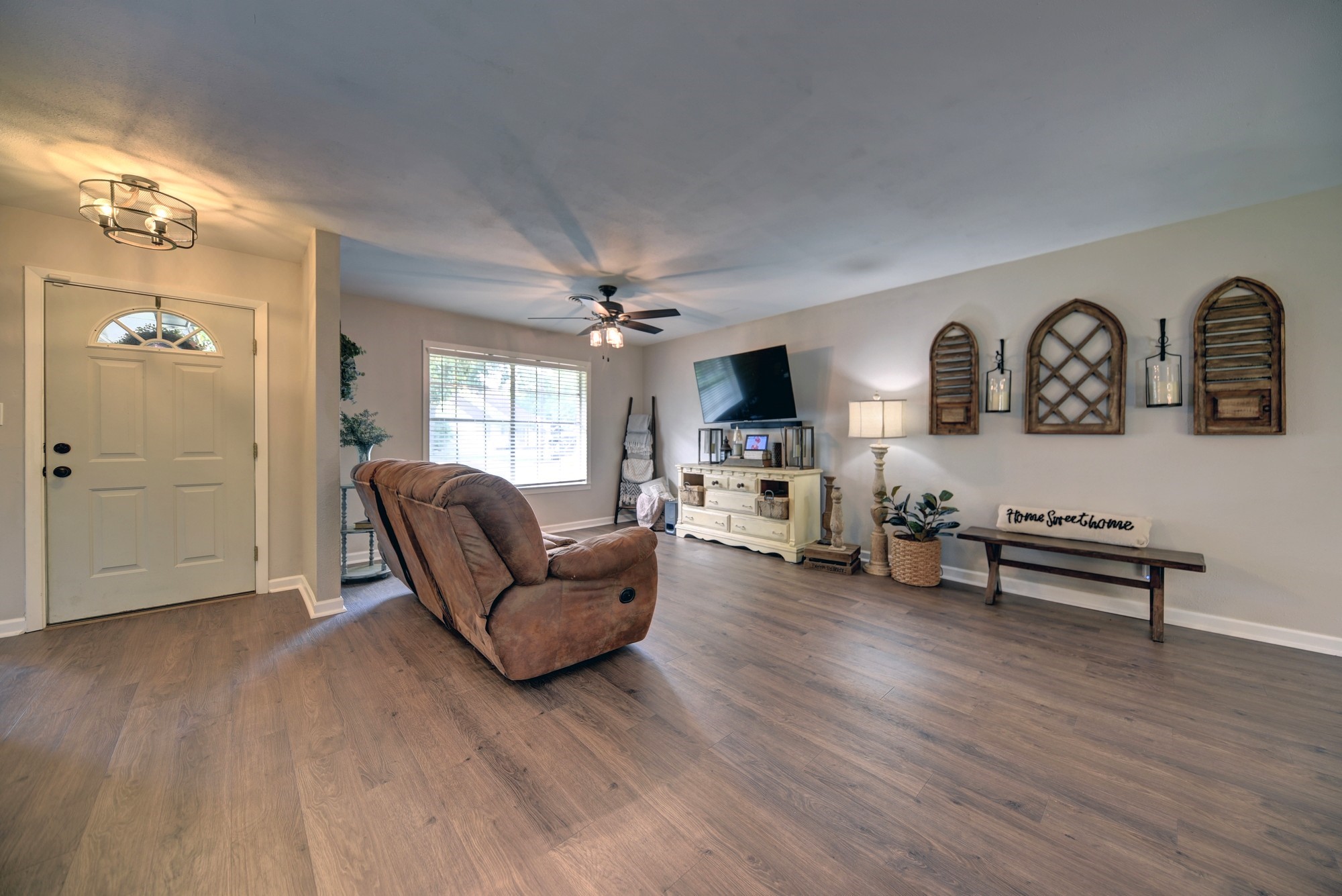 507 Sandra Drive Brenham, TX 77833 - Photo 7 of 30 a living room with furniture and a wooden floor
