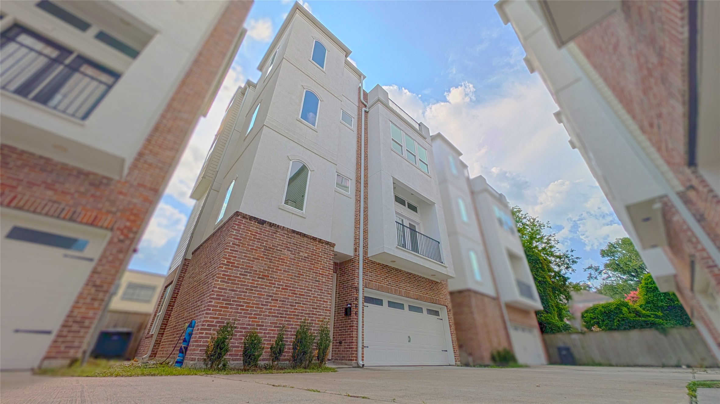 a view of a brick building next to a yard