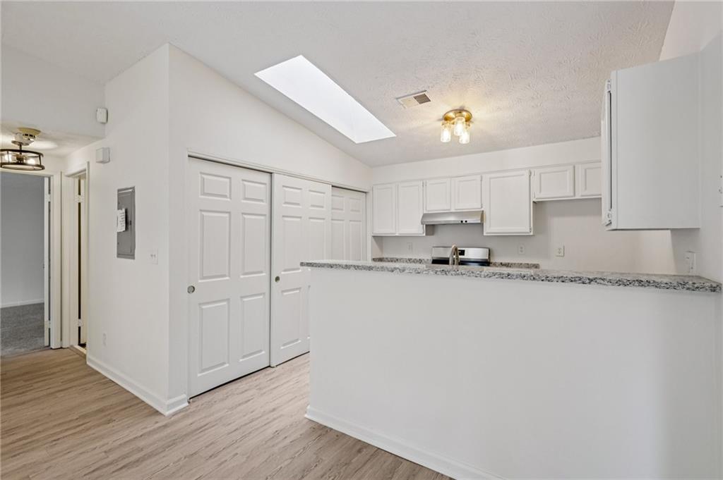 4263 Parkview Court Stone Mountain, GA 30083 - Photo 11 of 31 a view of a kitchen with wooden cabinet