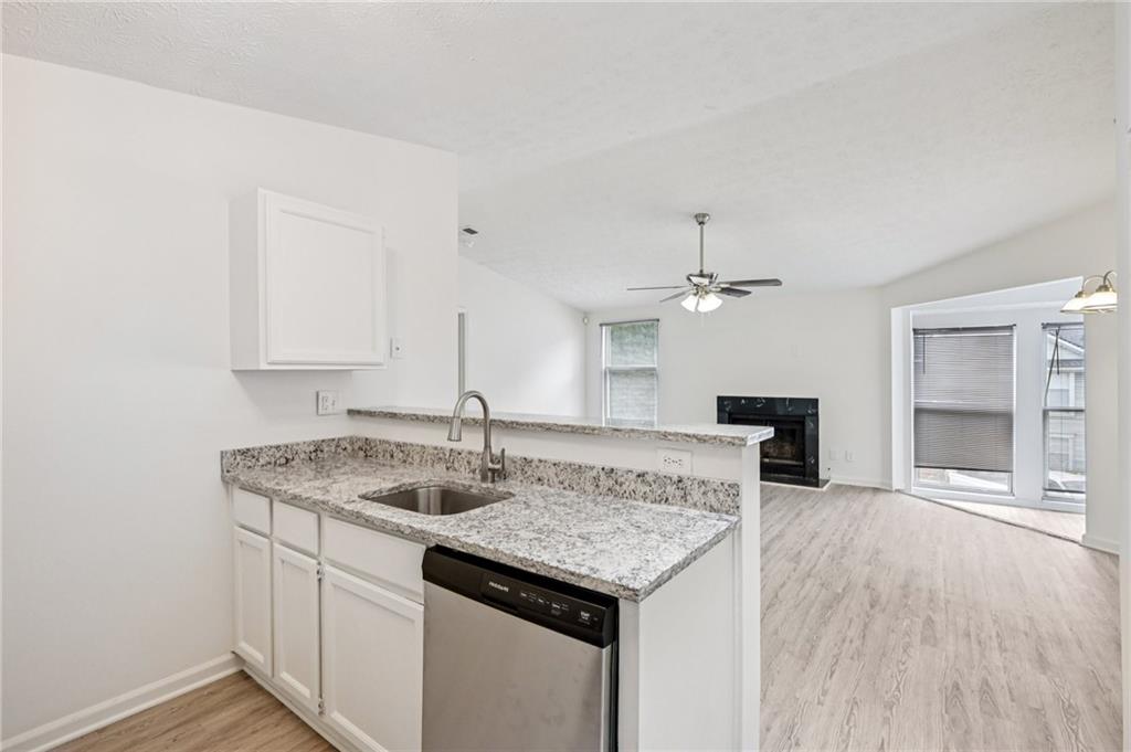 4263 Parkview Court Stone Mountain, GA 30083 - Photo 13 of 31 a kitchen with a sink and a refrigerator
