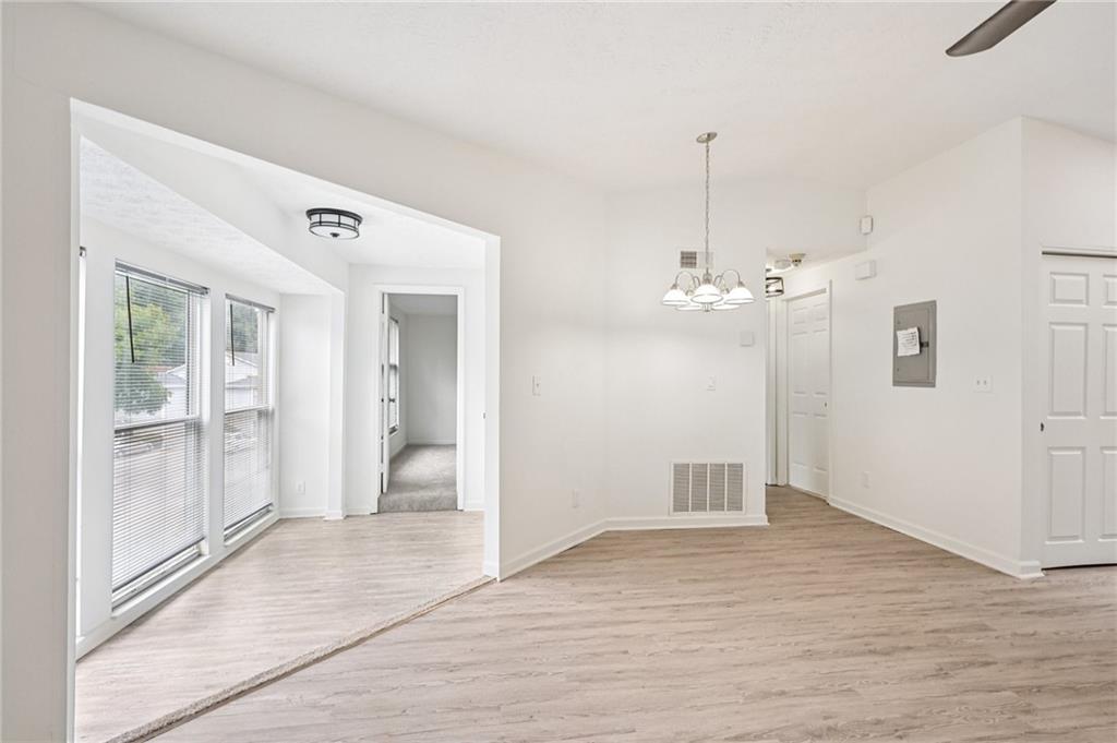 4263 Parkview Court Stone Mountain, GA 30083 - Photo 16 of 31 wooden floor in an empty room with a window