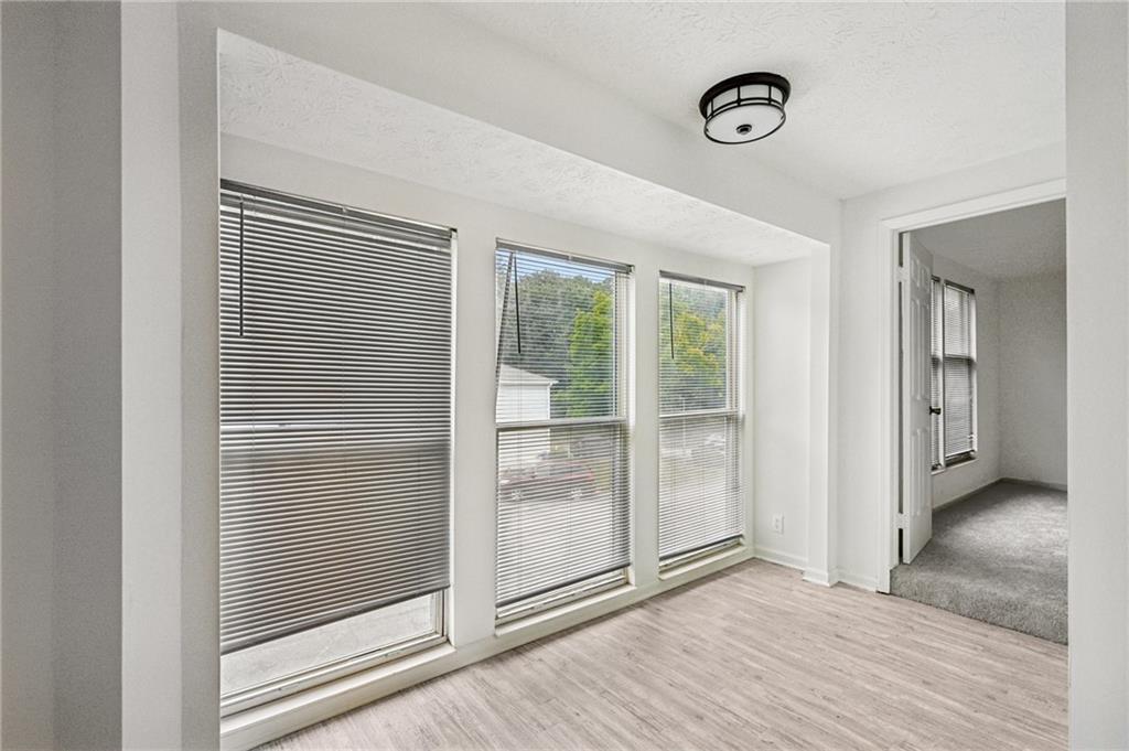 4263 Parkview Court Stone Mountain, GA 30083 - Photo 17 of 31 a view of an empty room with wooden floor