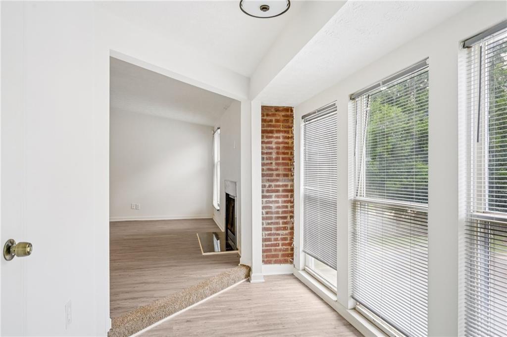 4263 Parkview Court Stone Mountain, GA 30083 - Photo 18 of 31 a view of a room with wooden floor and windows