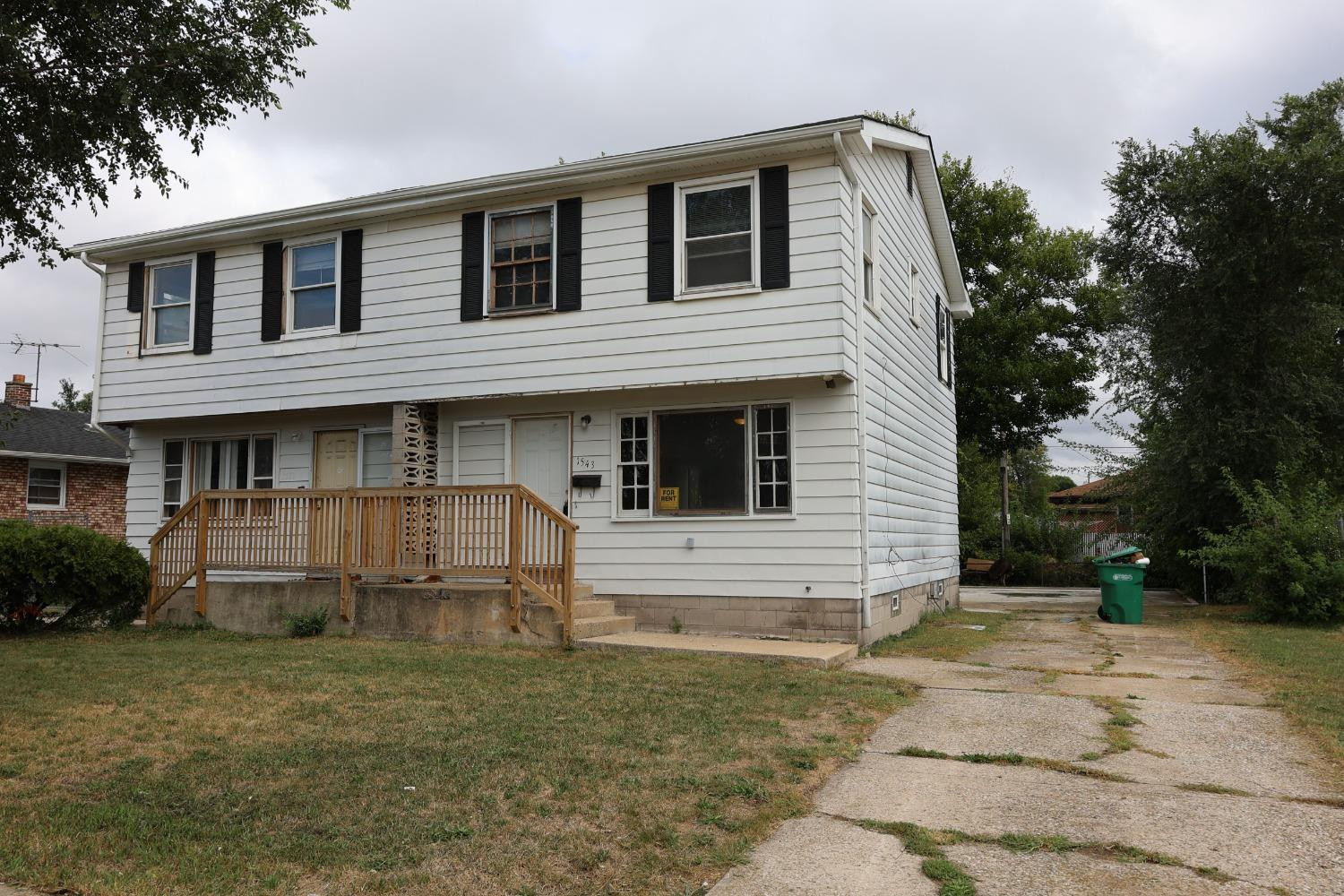 1543 Tennessee Street Gary, IN 46407 - Photo 1 of 22 a front view of a house with plants