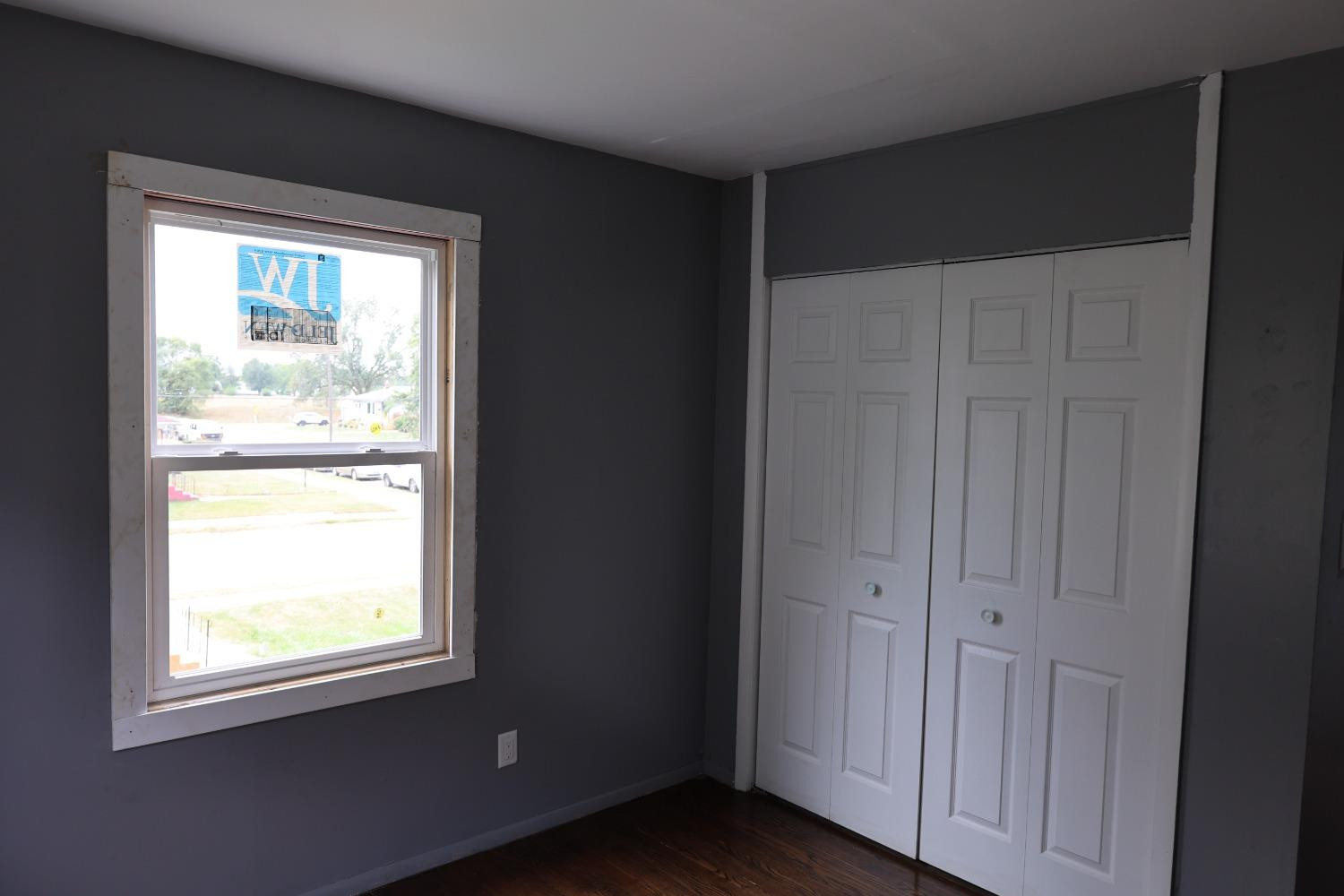 1543 Tennessee Street Gary, IN 46407 - Photo 16 of 22 an empty room with wooden floor and a window