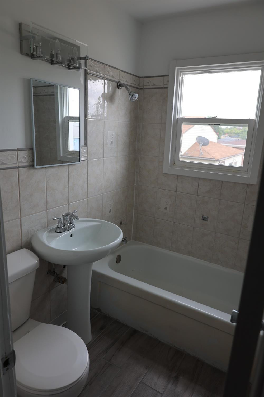 1543 Tennessee Street Gary, IN 46407 - Photo 19 of 22 a bathroom with a sink toilet and shower