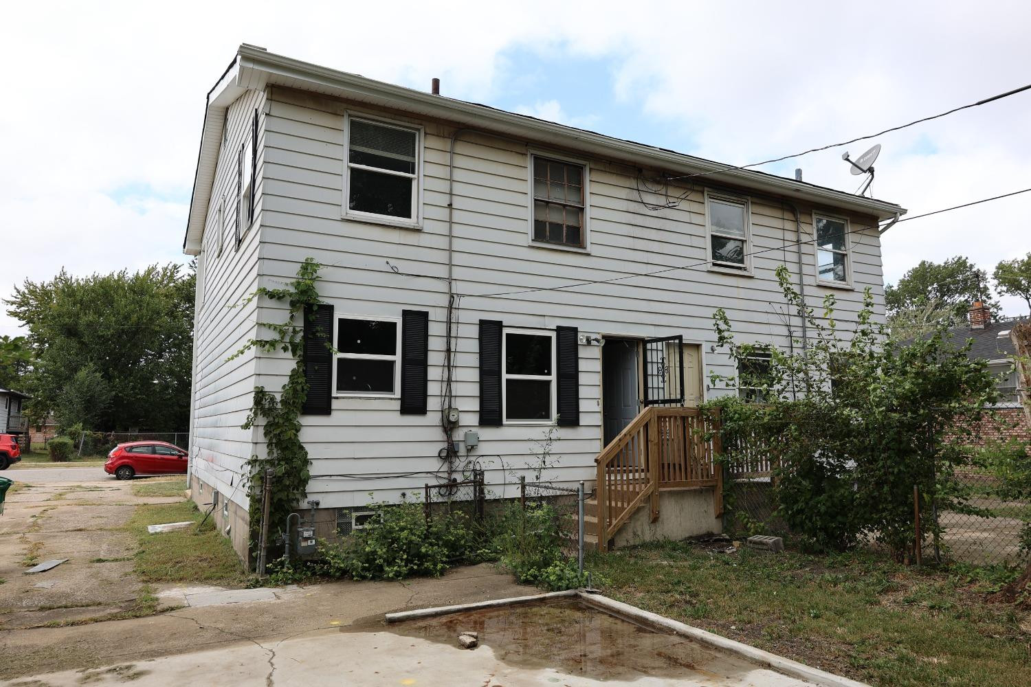 1543 Tennessee Street Gary, IN 46407 - Photo 2 of 22 a front view of a house with garden