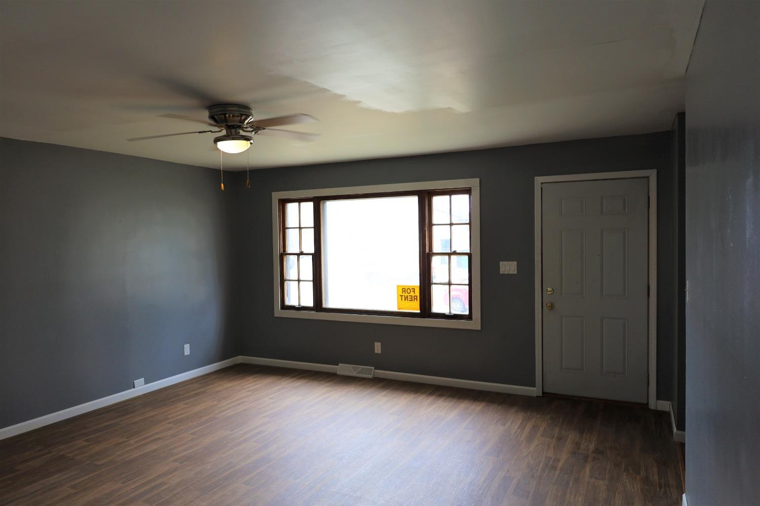 1543 Tennessee Street Gary, IN 46407 - Photo 3 of 22 an empty room with wooden floor and windows