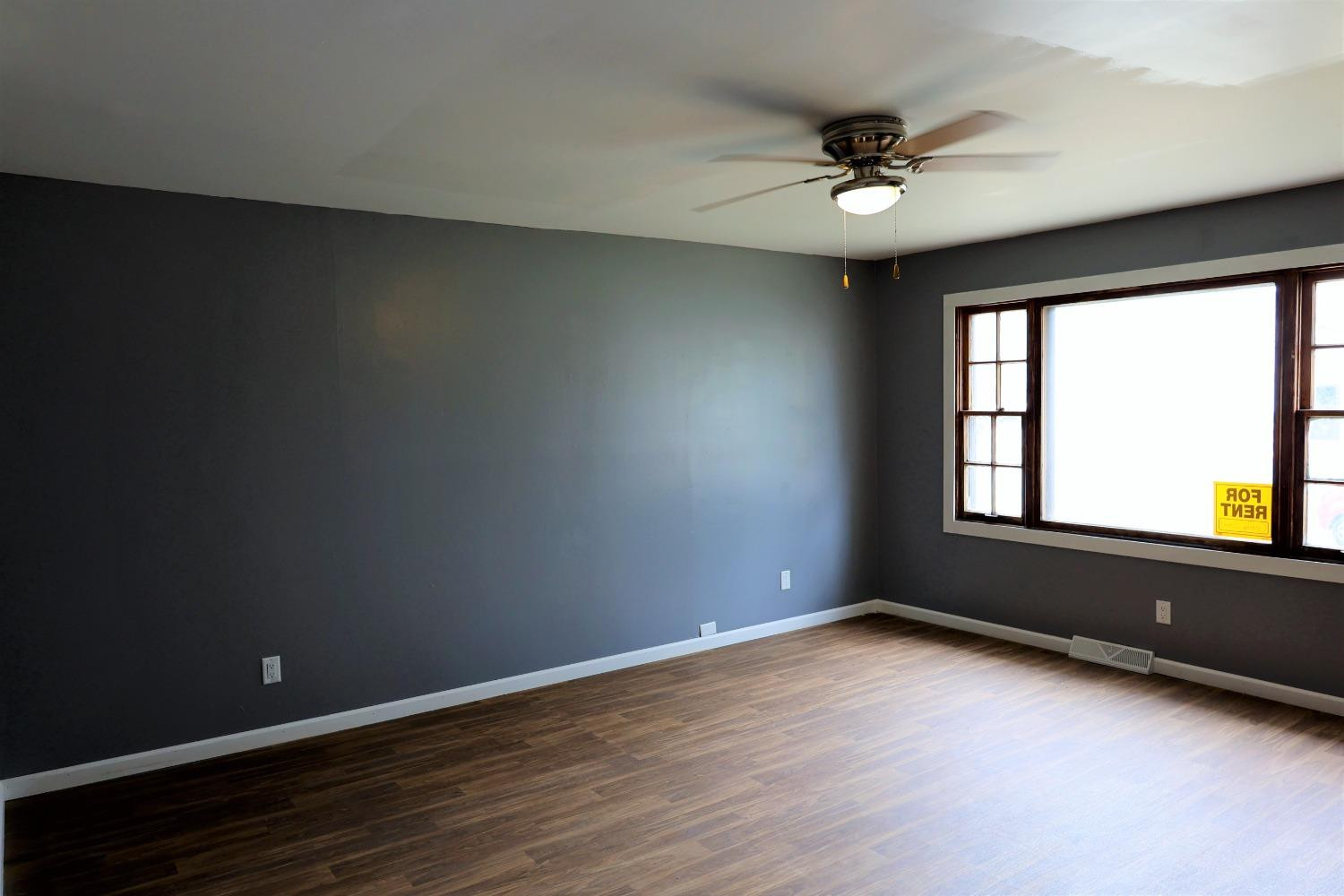 1543 Tennessee Street Gary, IN 46407 - Photo 5 of 22 wooden floor in an empty room with a window