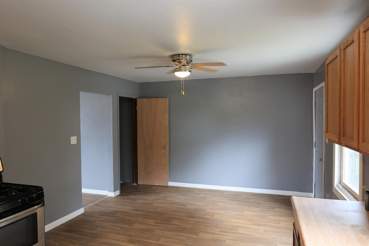 1543 Tennessee Street Gary, IN 46407 - Photo 9 of 22 wooden floor in an empty room with a window