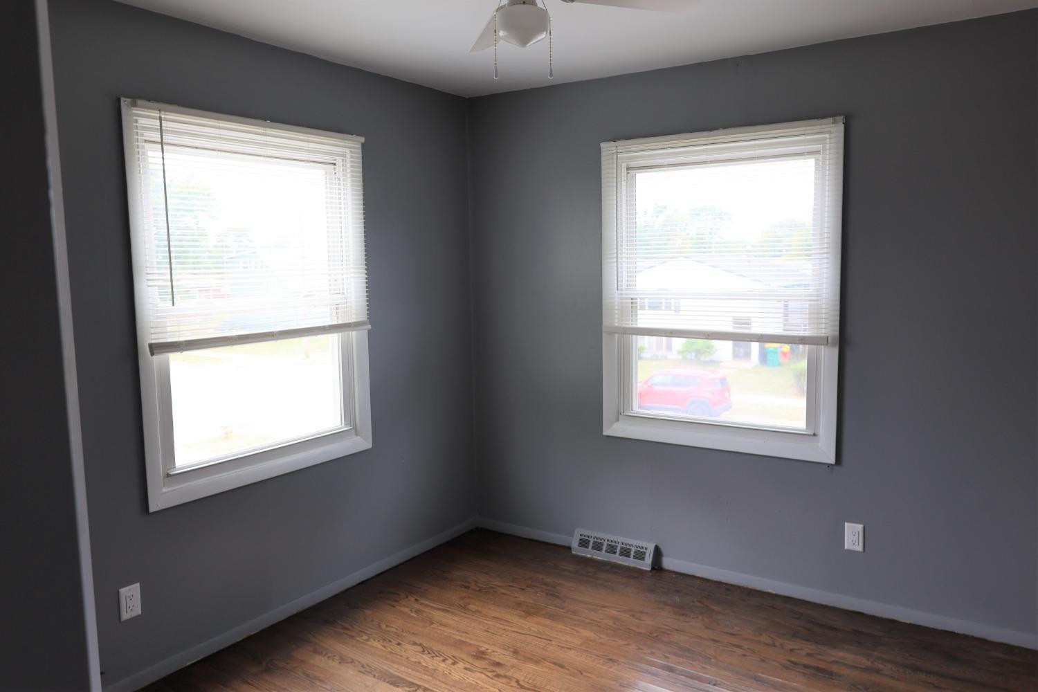 1543 Tennessee Street Gary, IN 46407 - Photo 10 of 22 a view of an empty room with wooden floor and a window