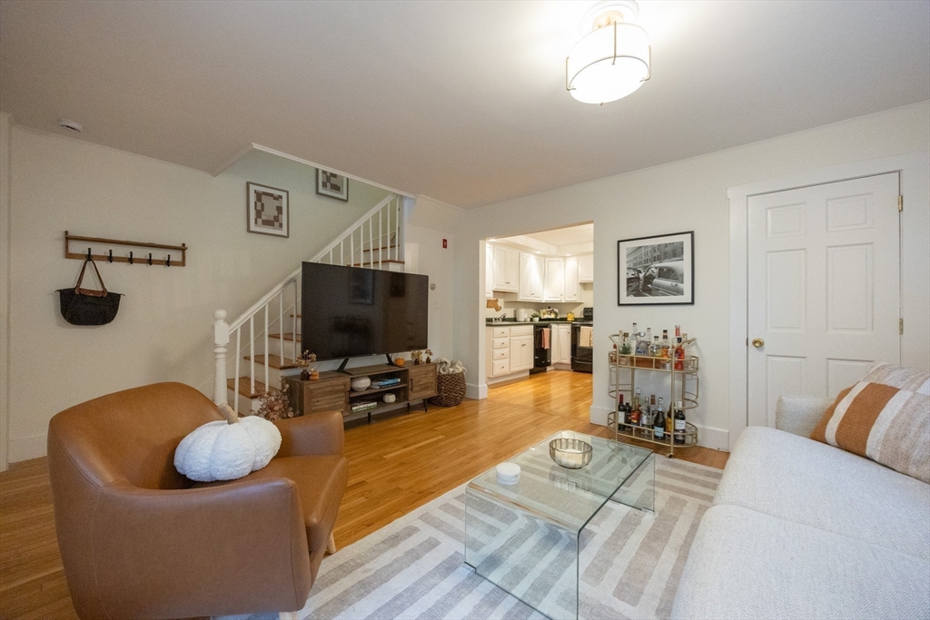 12 1st Street, Unit 12 Ipswich, MA 01938 - Photo 11 of 42 a living room with furniture and a flat screen tv