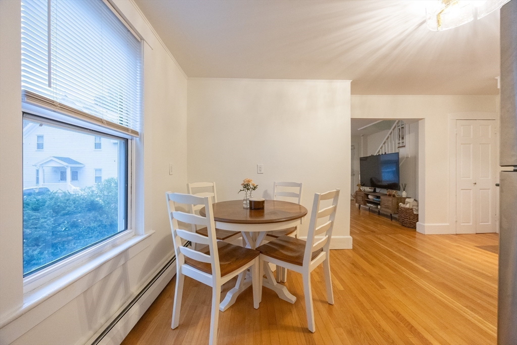 12 1st Street, Unit 12 Ipswich, MA 01938 - Photo 16 of 42 a view of a dining room with furniture and wooden floor