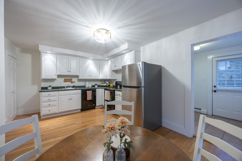 12 1st Street, Unit 12 Ipswich, MA 01938 - Photo 17 of 42 a kitchen with a refrigerator and a stove top oven