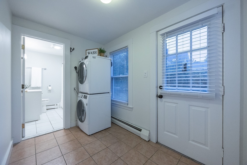 12 1st Street, Unit 12 Ipswich, MA 01938 - Photo 18 of 42 a refrigerator freezer sitting inside of a kitchen