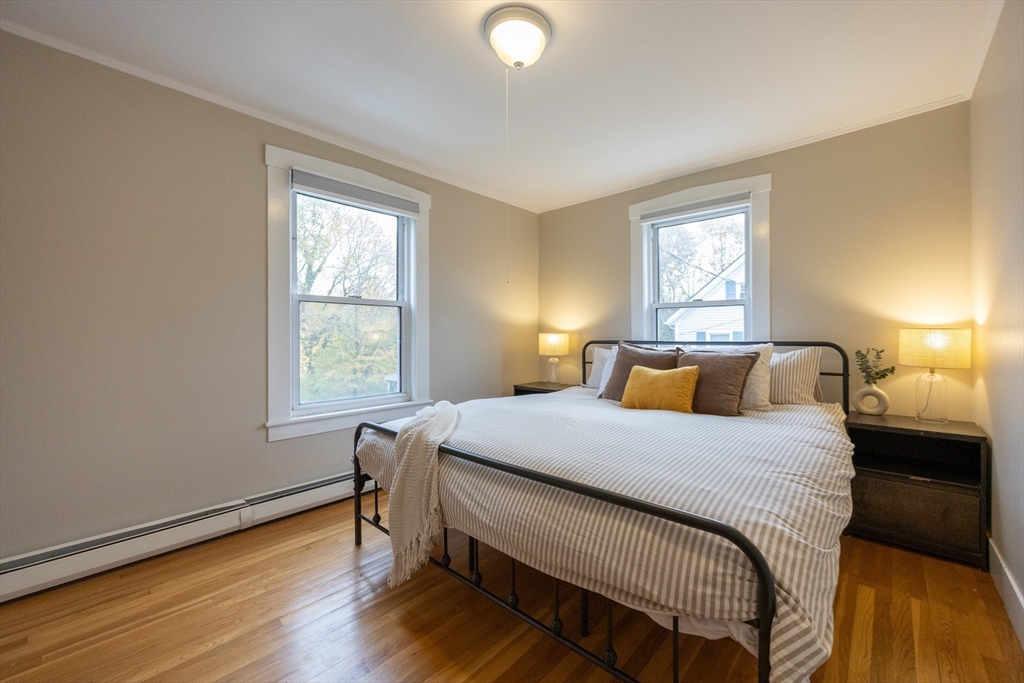 12 1st Street, Unit 12 Ipswich, MA 01938 - Photo 23 of 42 a bedroom with a bed and a window