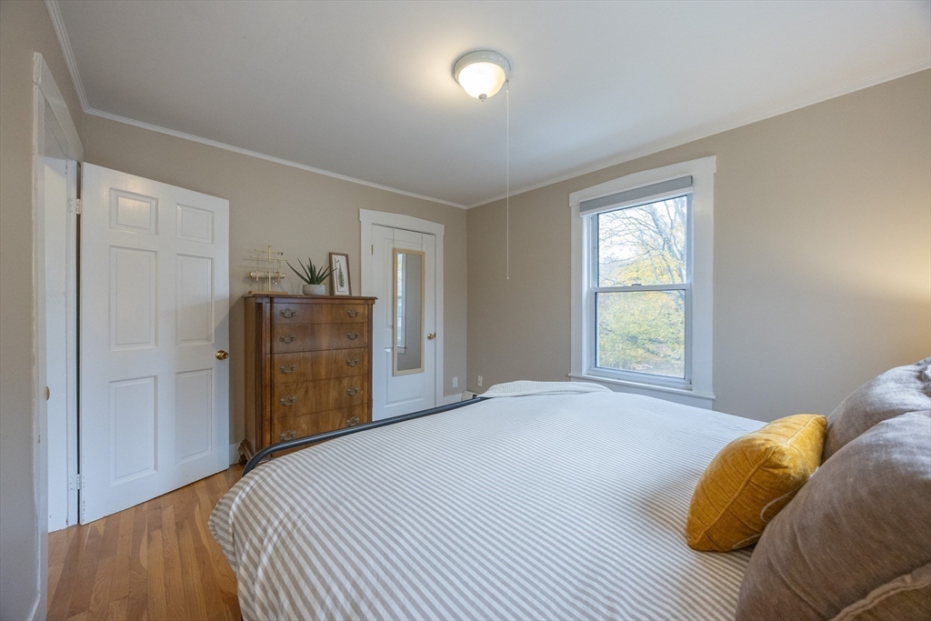 12 1st Street, Unit 12 Ipswich, MA 01938 - Photo 24 of 42 a bedroom with a bed and a window