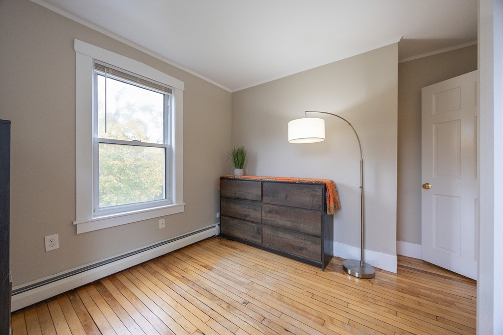 12 1st Street, Unit 12 Ipswich, MA 01938 - Photo 27 of 42 a room with a mirror and a window
