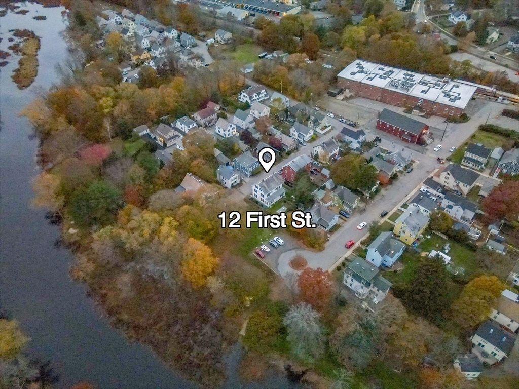 12 1st Street, Unit 12 Ipswich, MA 01938 - Photo 4 of 42 a view of a sign that is on a street