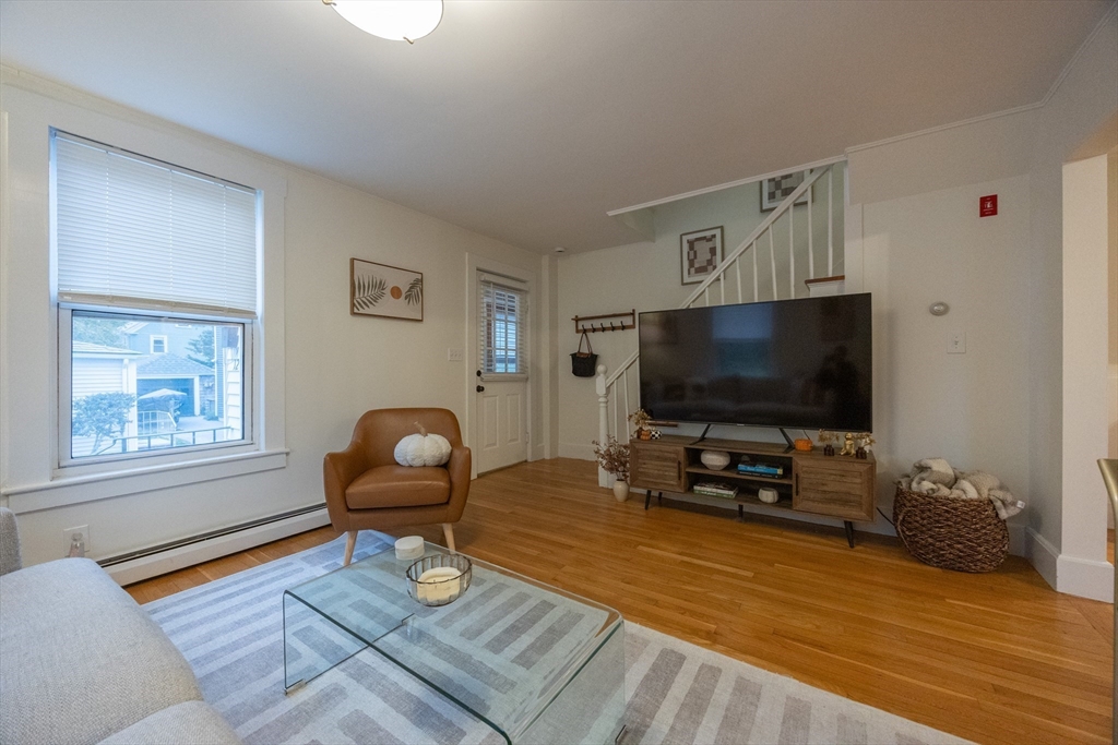 12 1st Street, Unit 12 Ipswich, MA 01938 - Photo 10 of 42 a living room with furniture and a flat screen tv