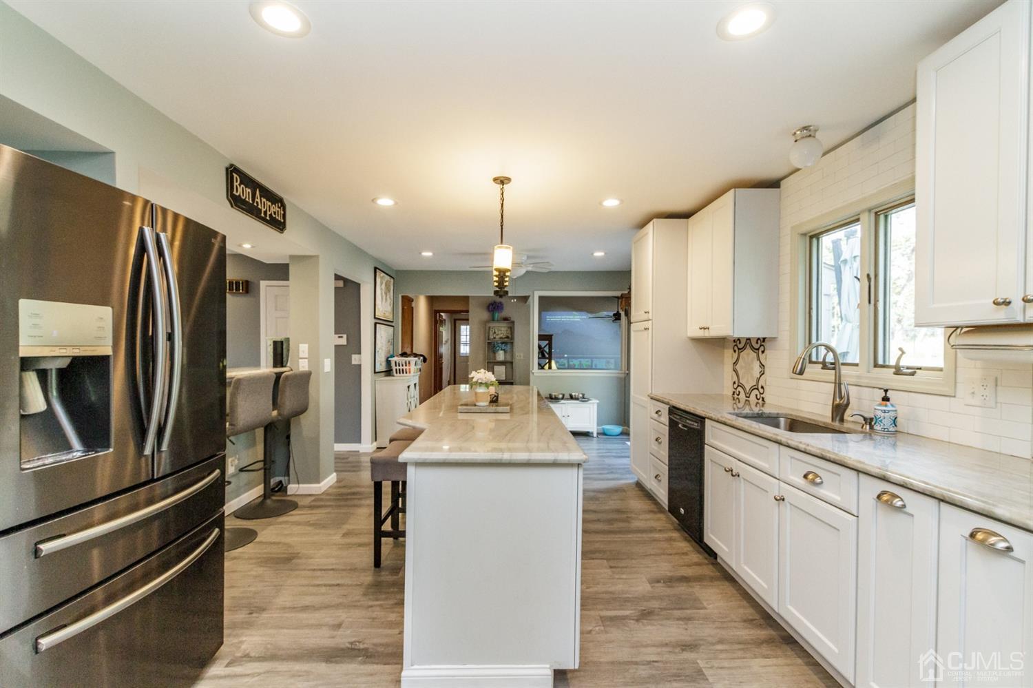 66 Rustic Trail Flemington, NJ 08822 - Photo 11 of 37 a kitchen with stainless steel appliances granite countertop a sink stove and refrigerator