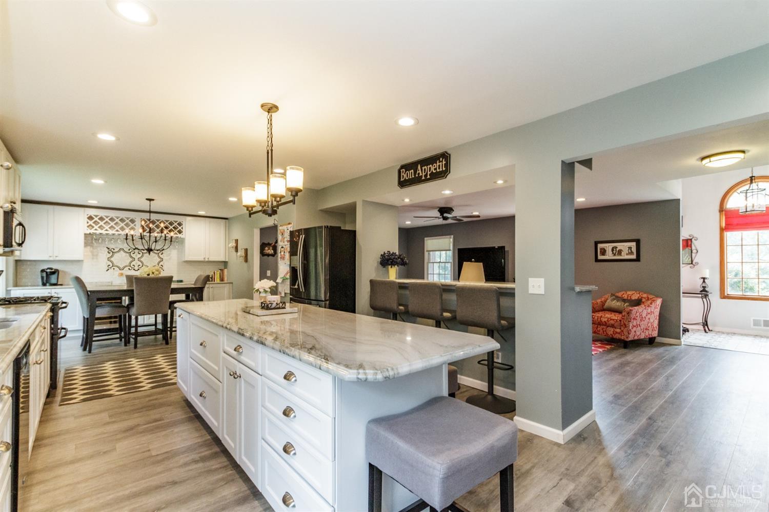 66 Rustic Trail Flemington, NJ 08822 - Photo 12 of 37 a large white kitchen with a large island oven a stove and a sink