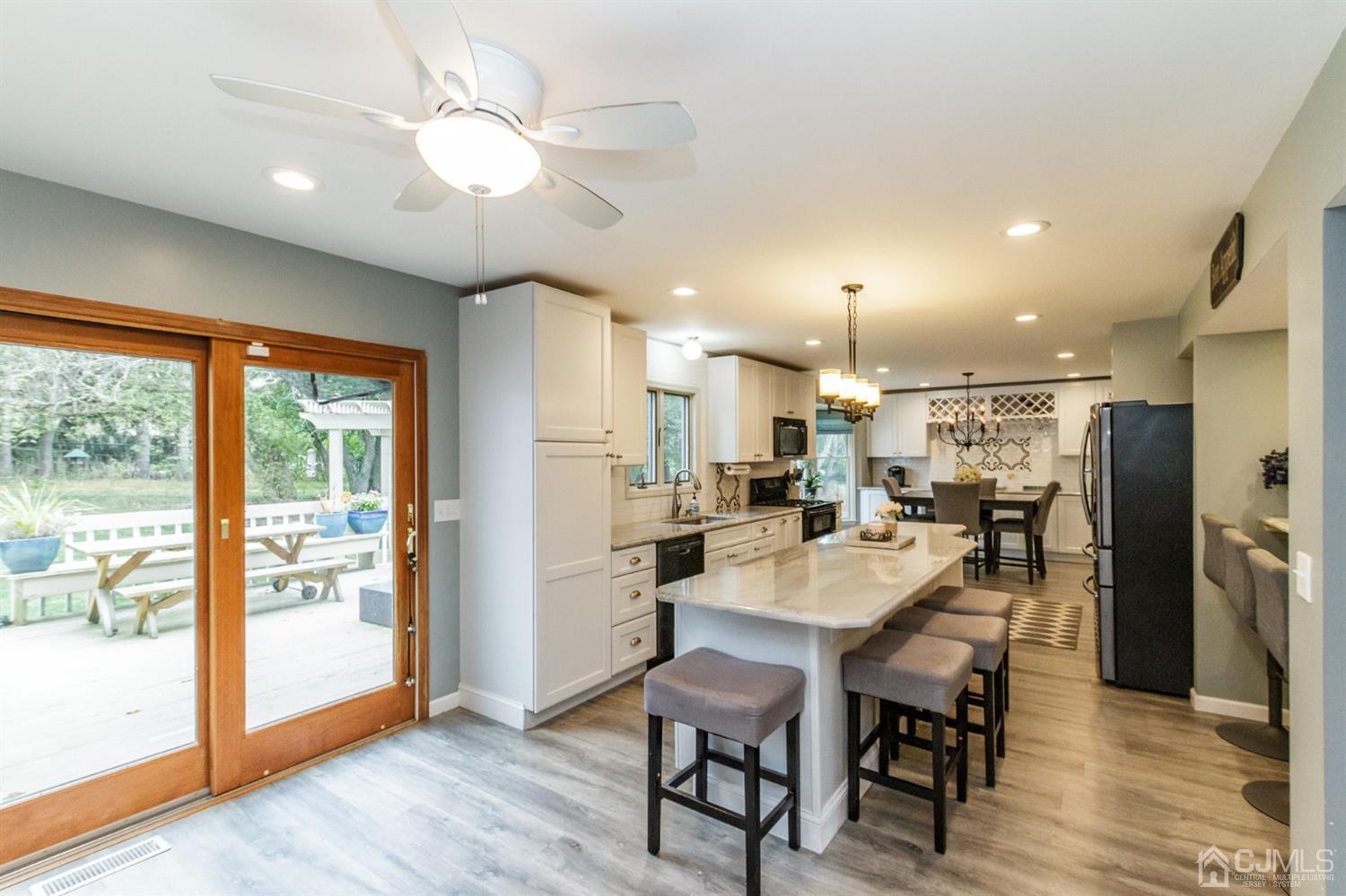 66 Rustic Trail Flemington, NJ 08822 - Photo 13 of 37 a view of a dining room with furniture window and wooden floor