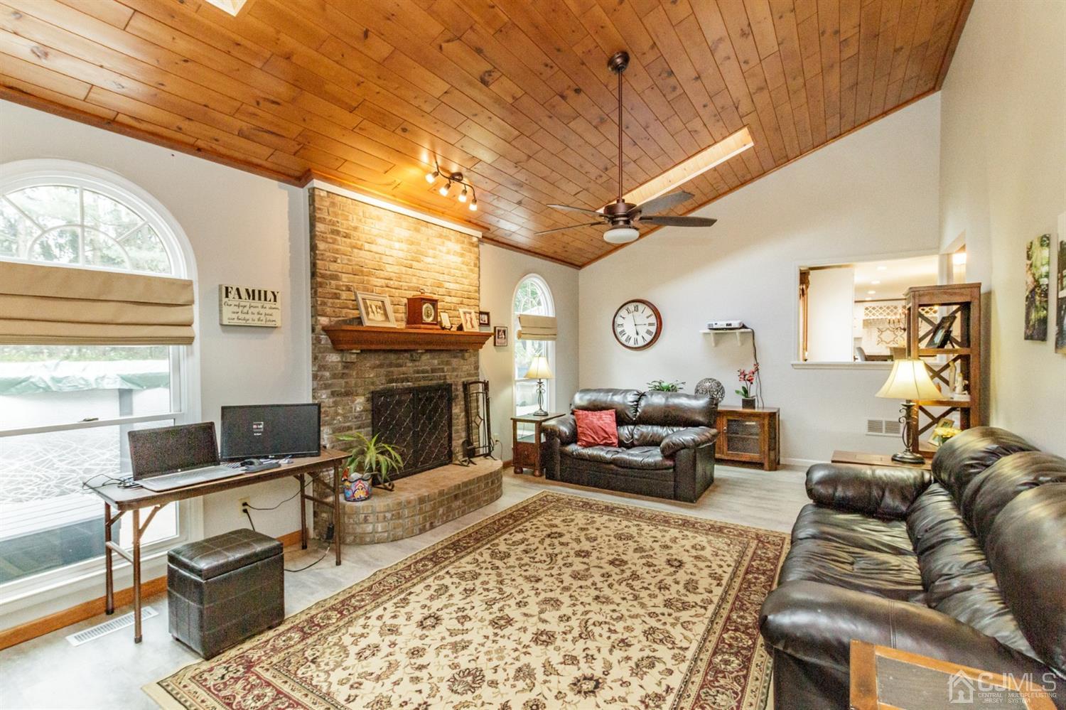 66 Rustic Trail Flemington, NJ 08822 - Photo 15 of 37 a living room with furniture a fireplace and a large window