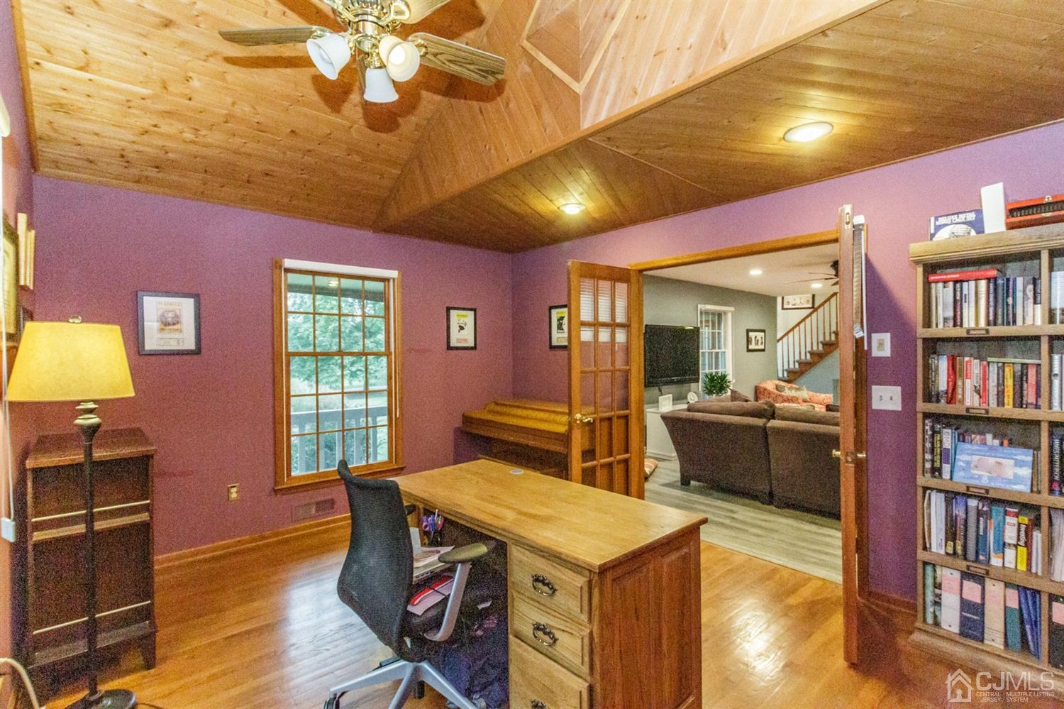 66 Rustic Trail Flemington, NJ 08822 - Photo 17 of 37 a dining room with furniture and a book shelf