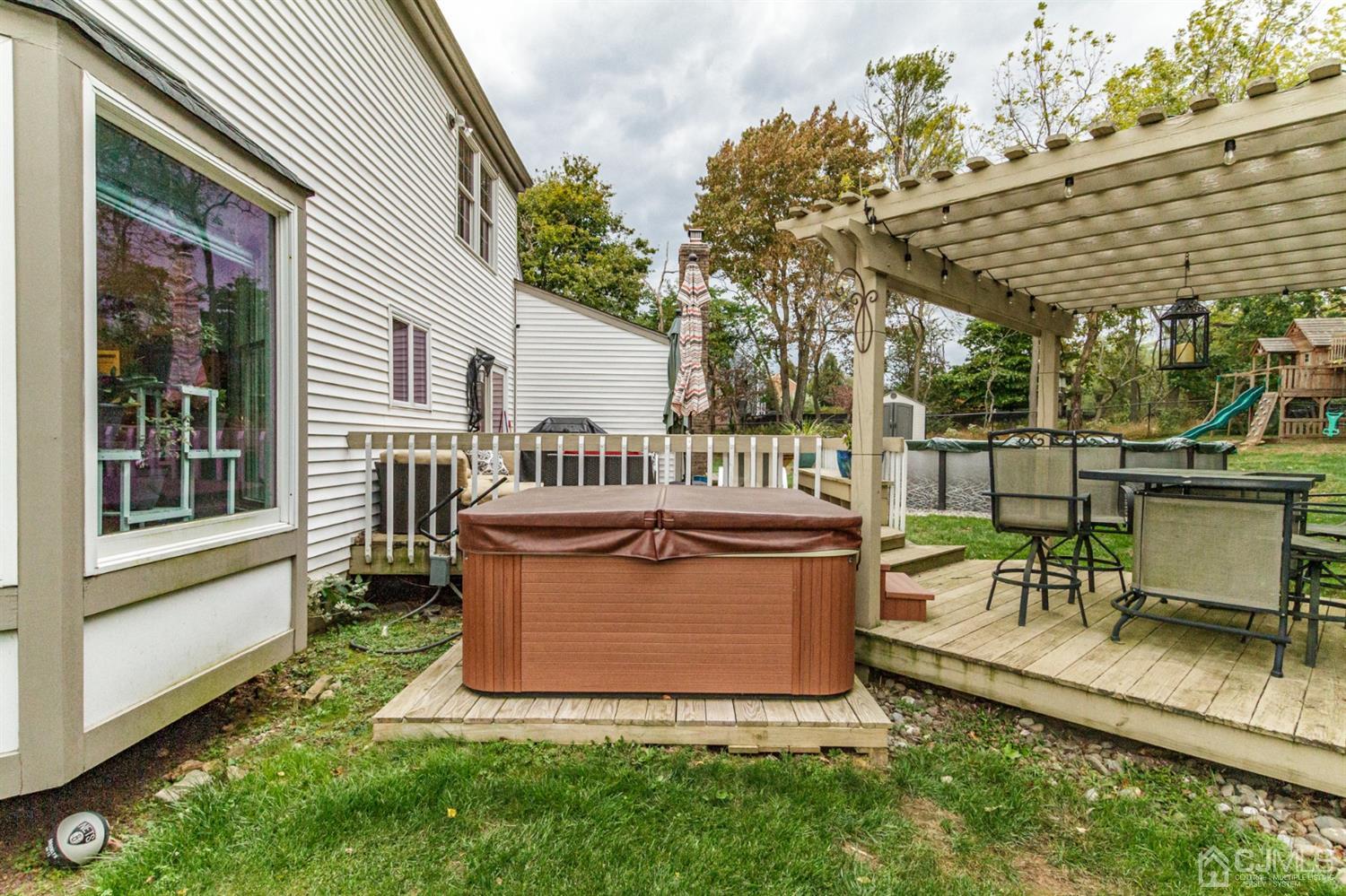66 Rustic Trail Flemington, NJ 08822 - Photo 34 of 37 a view of a chair and table in backyard of the house