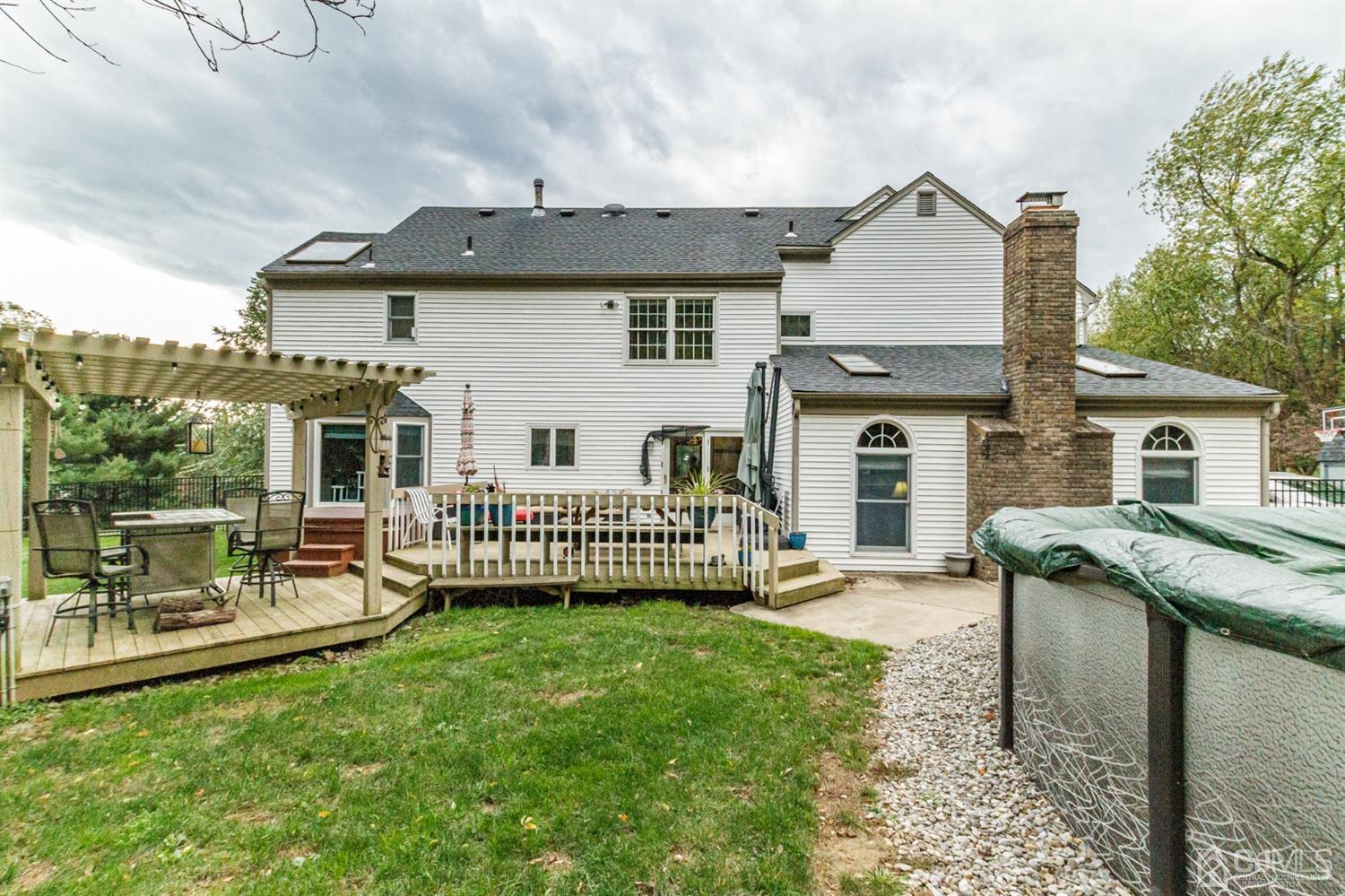 66 Rustic Trail Flemington, NJ 08822 - Photo 35 of 37 a view of a house with a yard and furniture