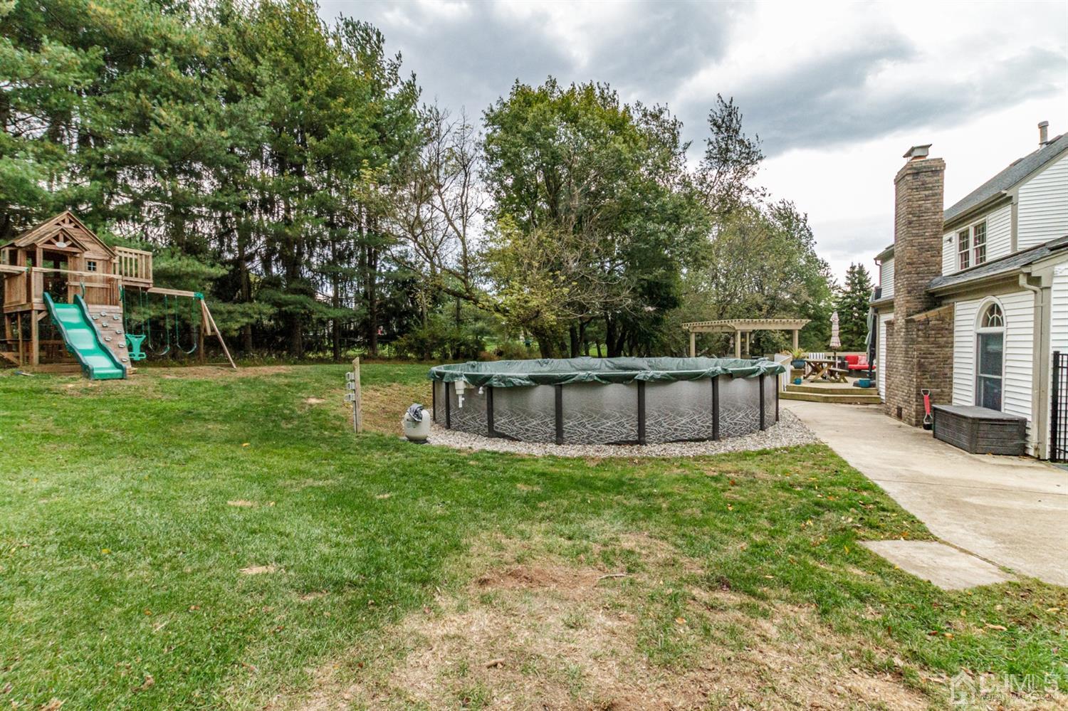 66 Rustic Trail Flemington, NJ 08822 - Photo 37 of 37 a view of a deck with a bench and trees