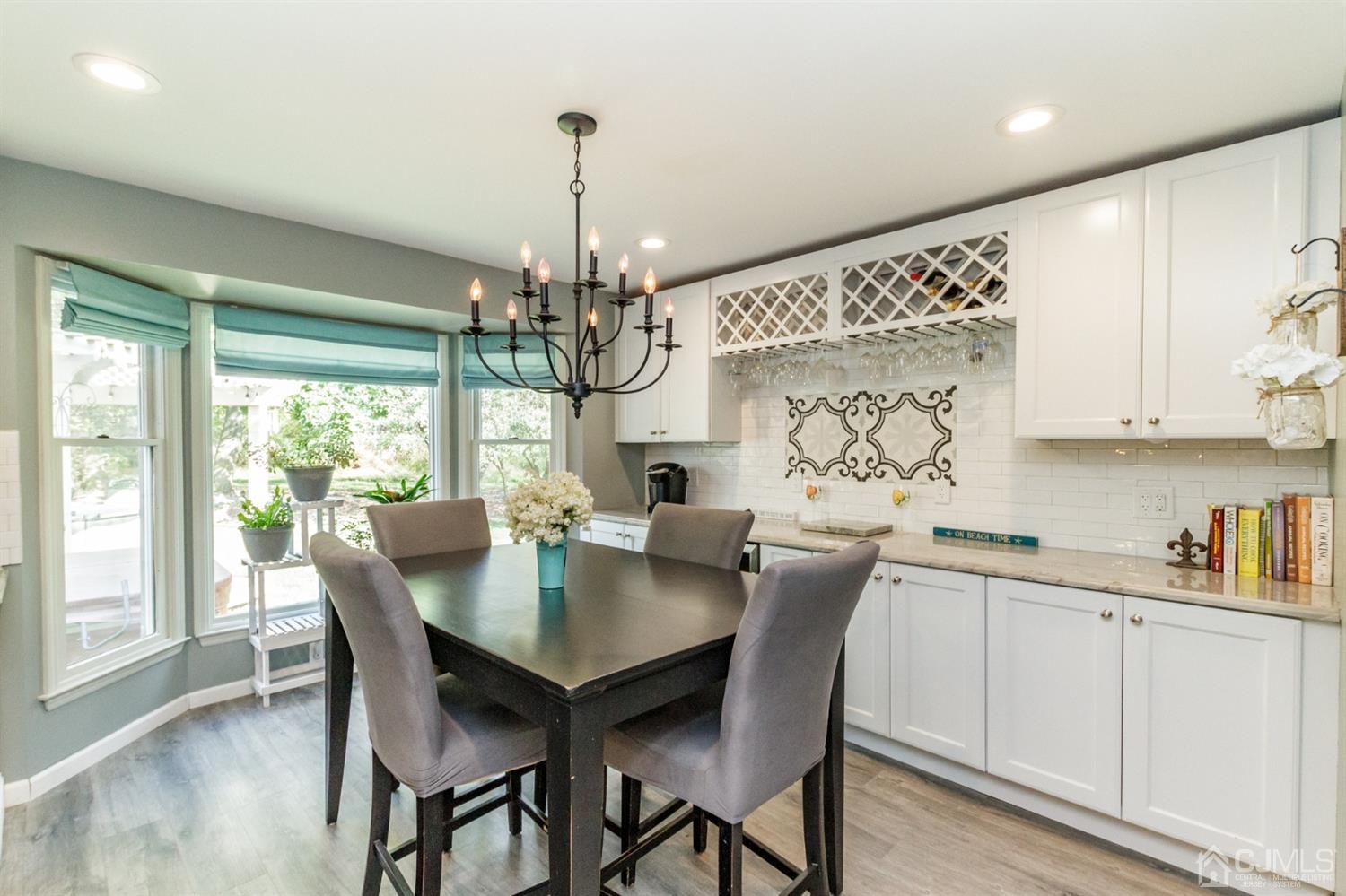 66 Rustic Trail Flemington, NJ 08822 - Photo 9 of 37 a view of a dining room with furniture window and wooden floor
