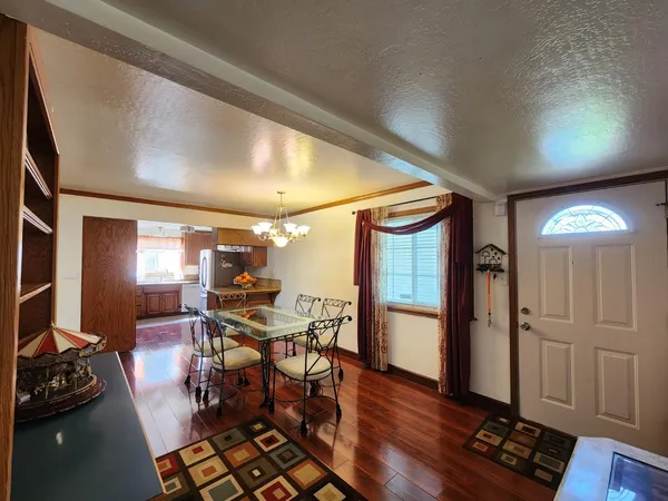 a kitchen with stainless steel appliances granite countertop a refrigerator sink and cabinets