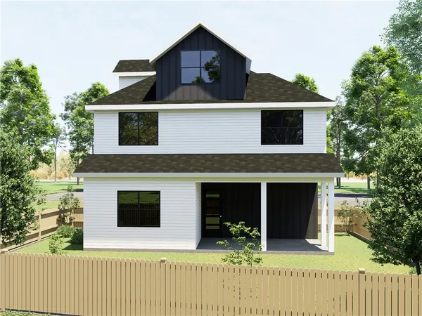 a house that has a tree in front of the house
