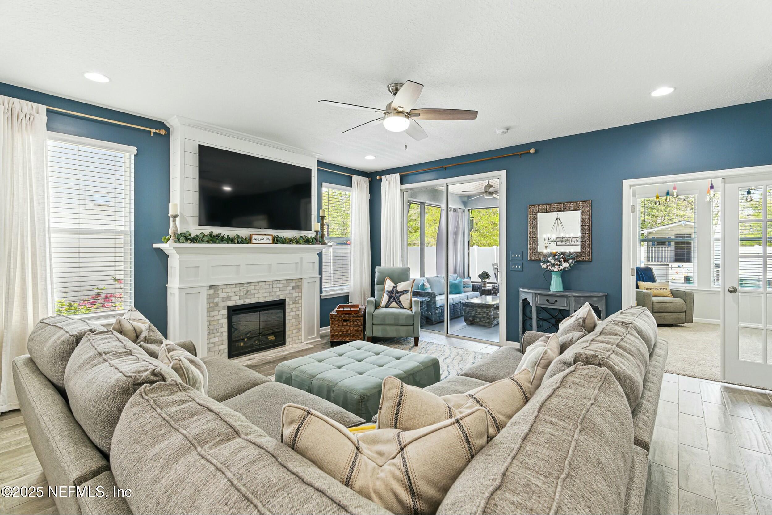30 Cloverbrook Road St. Johns, FL 32259 - Photo 11 of 69 a living room with furniture fireplace and flat screen tv
