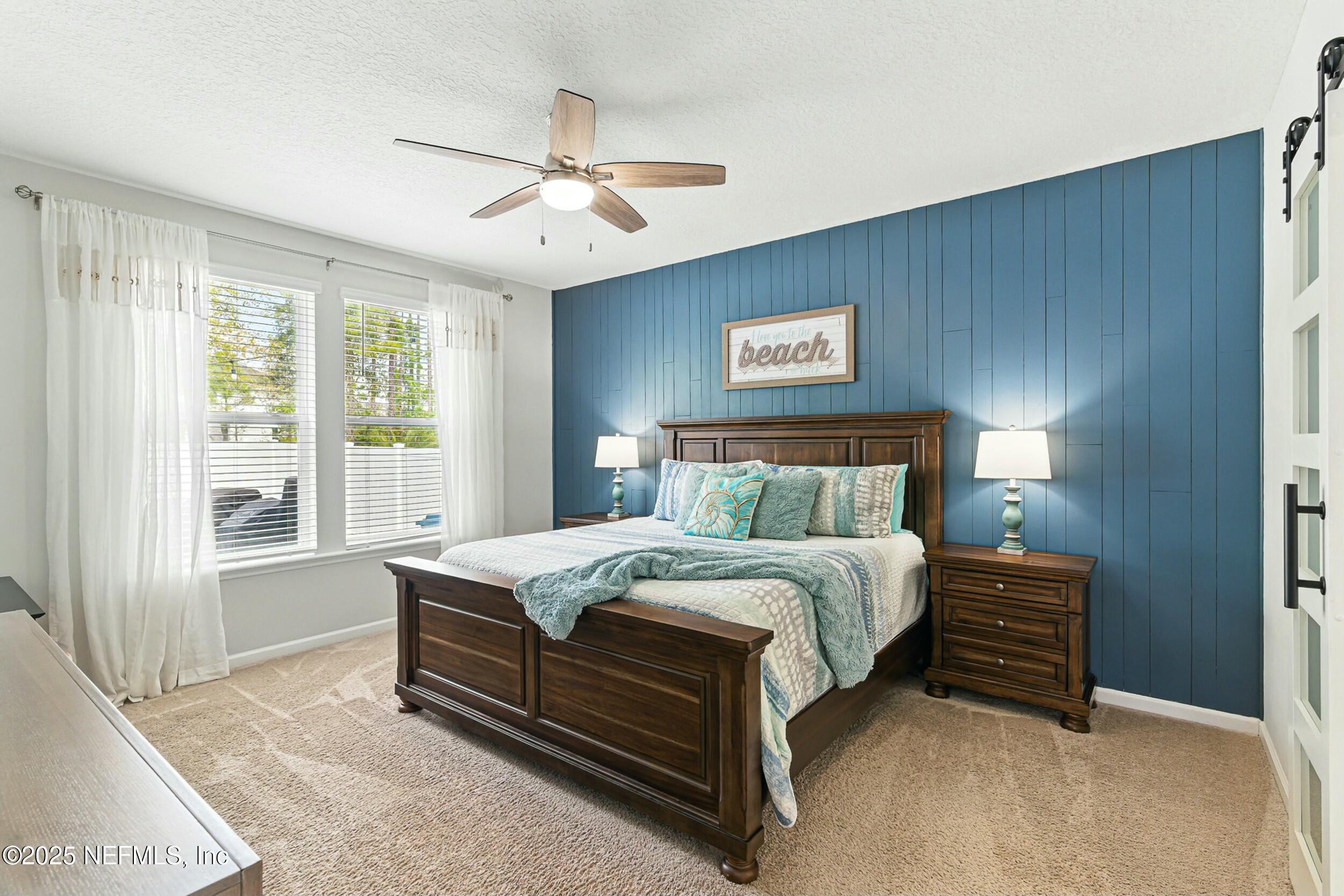 30 Cloverbrook Road St. Johns, FL 32259 - Photo 15 of 69 a bed sitting in a bedroom next to a window