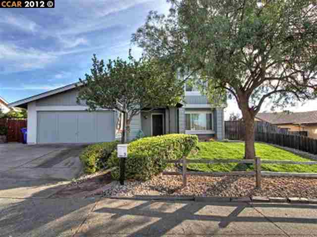 1262 Donald Drive Rodeo, CA 94572 - Photo 1 of 1 a front view of a house with garden
