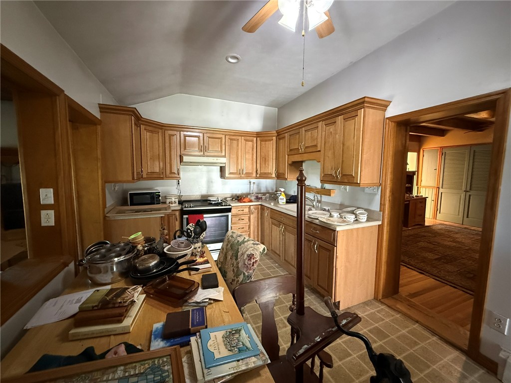 6617 Sweet Potato Ridge Road Englewood, OH 45322 - Photo 27 of 33 This spacious kitchen offers ample cabinetry and an inviting atmosphere for culinary endeavors.