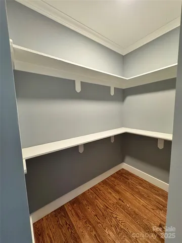 a view of a kitchen with a sink and a washer dryer