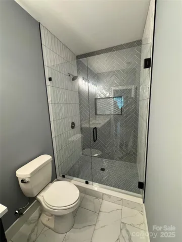 a bathroom with a sink vanity and mirror