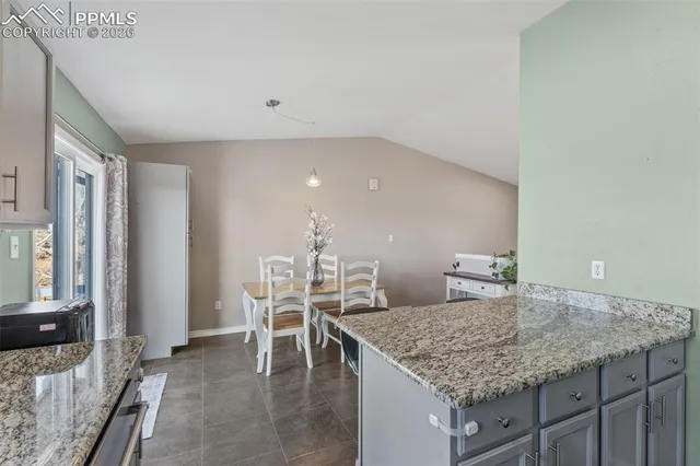 a bedroom with a bed couch and window