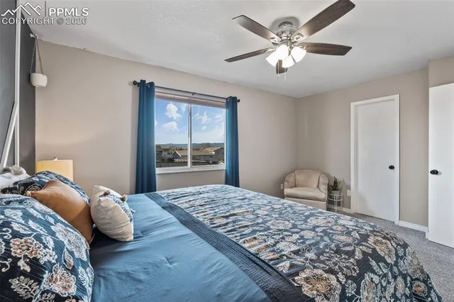 a bathroom with a granite countertop sink a toilet and a mirror