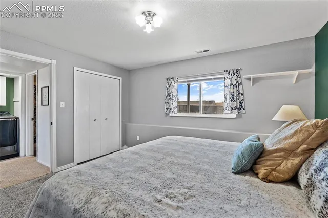 a bathroom with a sink toilet and mirror